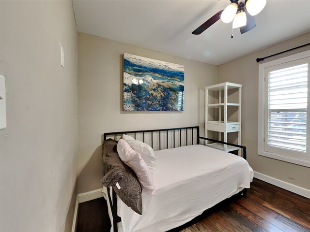 3127 Pastor St, Dallas, TX 75212 - bedroom with baseboards, wood finished floors, and a ceiling fan