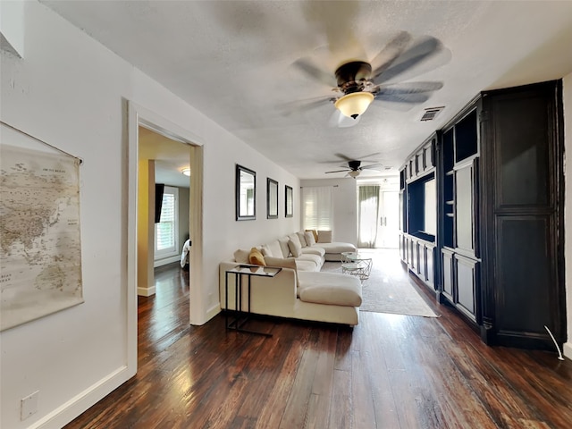 3127 Pastor St, Dallas, TX 75212 - living room featuring ceiling fan, dark wood-style floors, and baseboards
