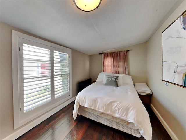 3127 Pastor St, Dallas, TX 75212 - bedroom with wood finished floors, baseboards, and vaulted ceiling