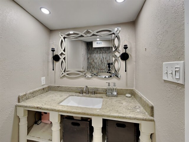 3127 Pastor St, Dallas, TX 75212 - bathroom with a sink, recessed lighting, and a textured wall
