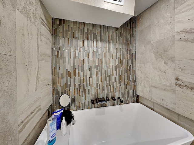 3127 Pastor St, Dallas, TX 75212 - bathroom with a freestanding bath and tile walls