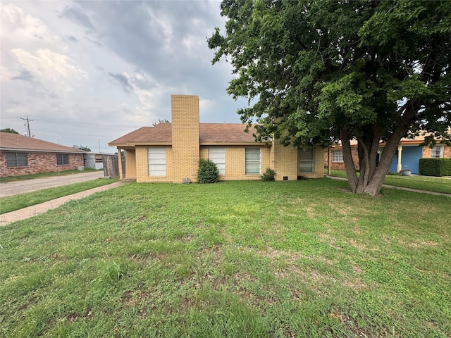 397 Somerset Pl, Abilene, TX 79601 - single story home with brick siding, a chimney, and a front lawn