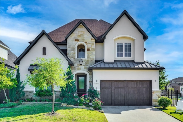 6009 Westchester Ln, Frisco, TX 75034 - french country style house featuring stone siding, a standing seam roof, a garage, and stucco siding
