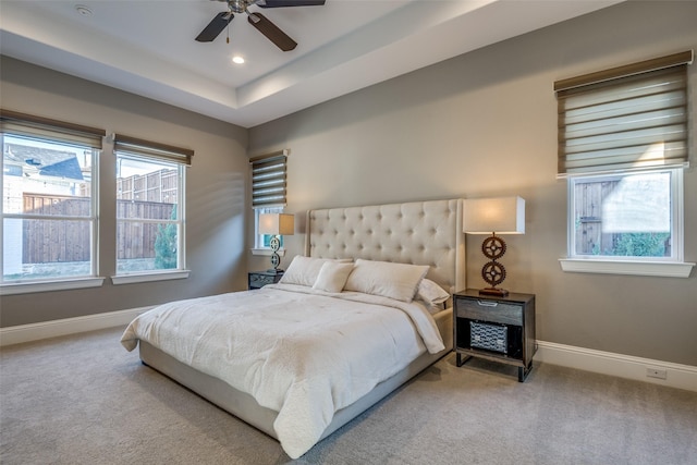 6009 Westchester Ln, Frisco, TX 75034 - carpeted bedroom featuring baseboards, a tray ceiling, a ceiling fan, and recessed lighting