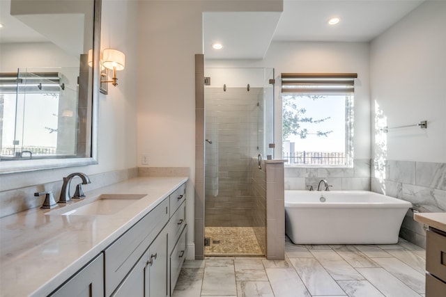 6009 Westchester Ln, Frisco, TX 75034 - full bathroom featuring a stall shower, vanity, marble finish floors, a freestanding bath, and recessed lighting