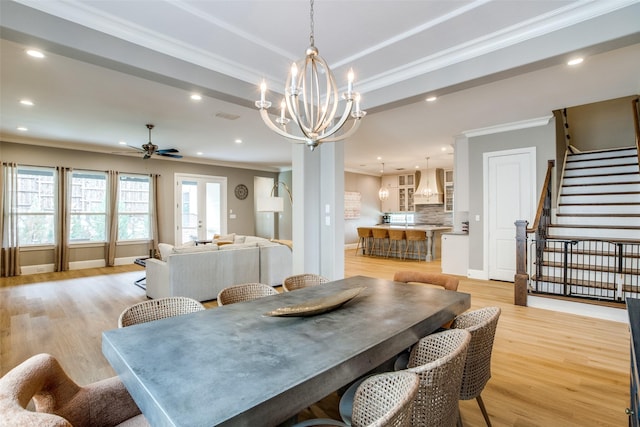6009 Westchester Ln, Frisco, TX 75034 - dining area with a chandelier, ornamental molding, a ceiling fan, light wood finished floors, and recessed lighting