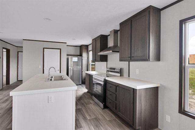 1203 Old Ida Rd, Sherman, TX 75090 - kitchen featuring stainless steel appliances, wall chimney exhaust hood, a sink, plenty of natural light, and crown molding