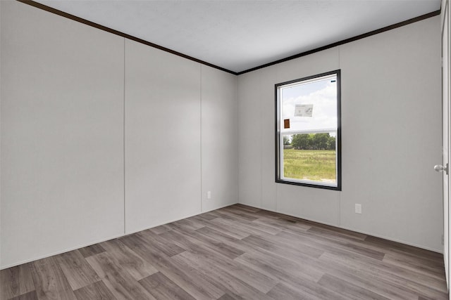 1203 Old Ida Rd, Sherman, TX 75090 - spare room with ornamental molding and light wood-type flooring