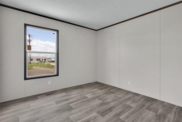 1203 Old Ida Rd, Sherman, TX 75090 - unfurnished room with ornamental molding and light wood finished floors
