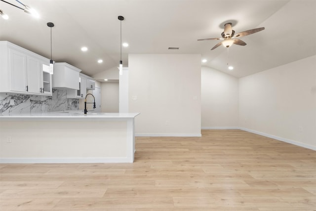 1832 Arch St, Fort Worth, TX 76105 - kitchen featuring a sink, lofted ceiling, ceiling fan, light countertops, and a peninsula