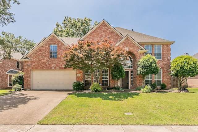 415 Saddle Tree Trl, Coppell, TX 75019 - traditional home featuring an attached garage, brick siding, a front lawn, concrete driveway, and roof with shingles