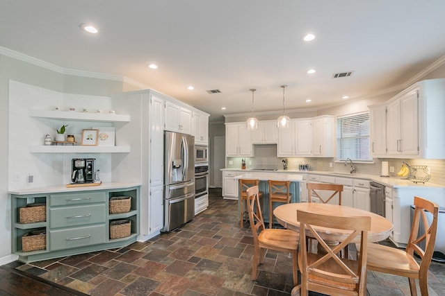 415 Saddle Tree Trl, Coppell, TX 75019 - kitchen with appliances with stainless steel finishes, a sink, open shelves, light countertops, and ornamental molding