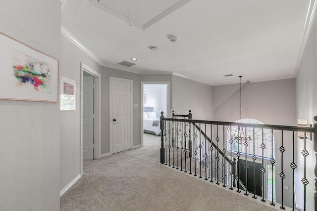 415 Saddle Tree Trl, Coppell, TX 75019 - hall with attic access, carpet, baseboards, ornamental molding, and an upstairs landing