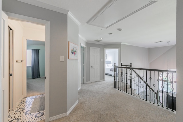 415 Saddle Tree Trl, Coppell, TX 75019 - hallway featuring attic access, crown molding, carpet flooring, baseboards, and an upstairs landing