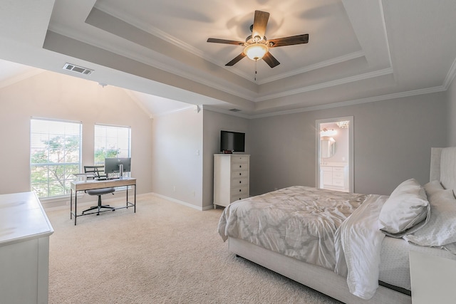 415 Saddle Tree Trl, Coppell, TX 75019 - carpeted bedroom with a raised ceiling, a desk, crown molding, ensuite bathroom, and a ceiling fan