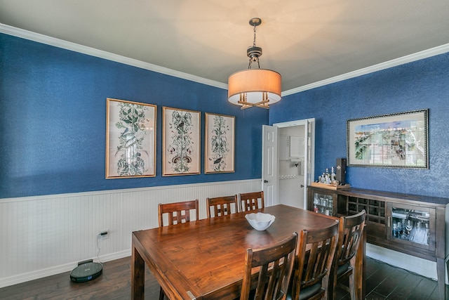 415 Saddle Tree Trl, Coppell, TX 75019 - dining room featuring wood-type flooring, ornamental molding, and a wainscoted wall