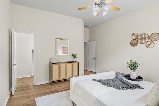 906 Cougar Dr, Allen, TX 75013 - bedroom with light wood-style floors, baseboards, and a ceiling fan