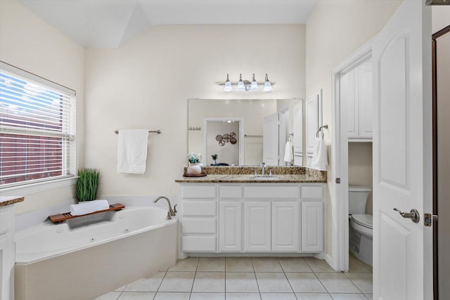 906 Cougar Dr, Allen, TX 75013 - bathroom with tile patterned flooring, a jetted tub, toilet, and vanity