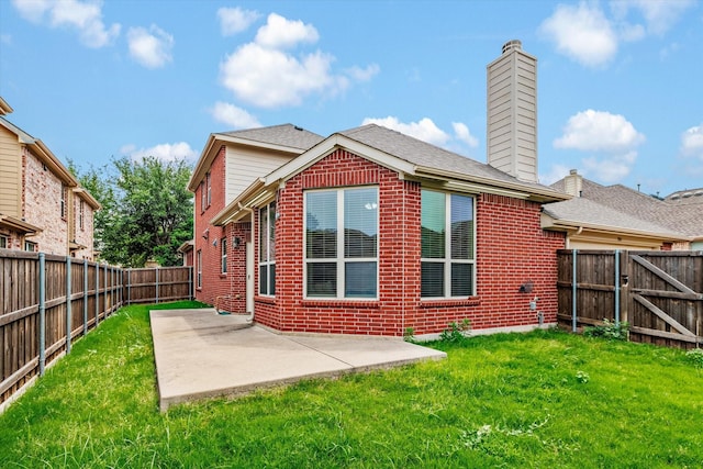 906 Cougar Dr, Allen, TX 75013 - back of house featuring brick siding, a patio, and a chimney
