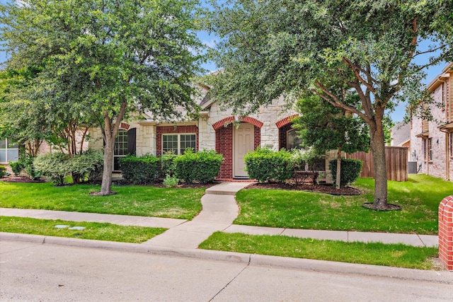 906 Cougar Dr, Allen, TX 75013 - obstructed view of property with stone siding