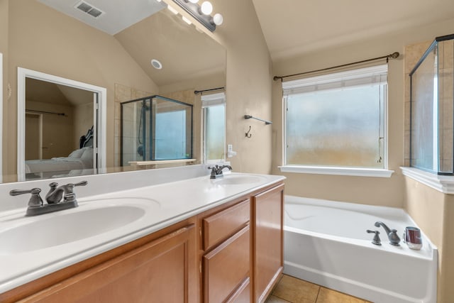 632 Shotwell St, Crowley, TX 76036 - full bath with lofted ceiling, tile patterned floors, a stall shower, a bath, and double vanity