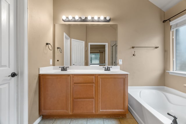 632 Shotwell St, Crowley, TX 76036 - full bath featuring a garden tub, tile patterned floors, double vanity, and healthy amount of natural light