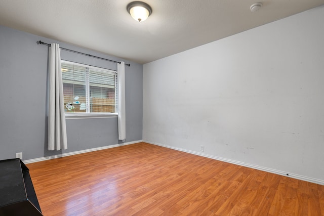 632 Shotwell St, Crowley, TX 76036 - spare room featuring light wood-type flooring, baseboards, and a smoke detector