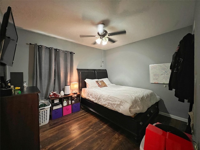 bedroom with wood finished floors and a ceiling fan