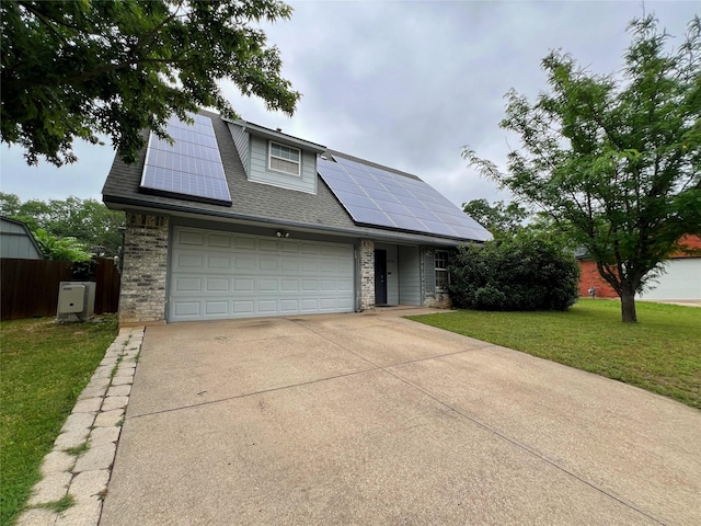 view of front of home featuring roof mounted solar panels, concrete driveway, roof with shingles, and brick siding