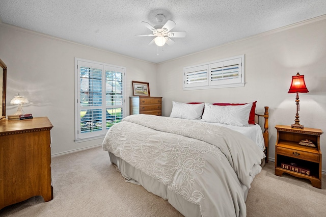 4006 Thornhill Way, Rowlett, TX 75088 - bedroom featuring light carpet, crown molding, a textured ceiling, a ceiling fan, and baseboards