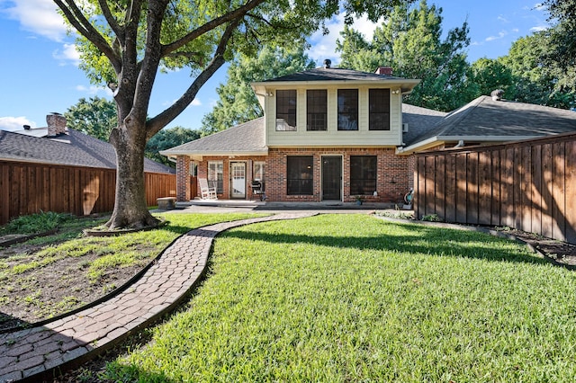 4006 Thornhill Way, Rowlett, TX 75088 - rear view of property with brick siding, a patio, roof with shingles, and a chimney