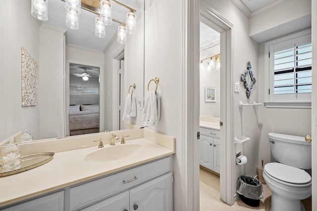 4006 Thornhill Way, Rowlett, TX 75088 - ensuite bathroom featuring toilet, crown molding, vanity, and a textured ceiling