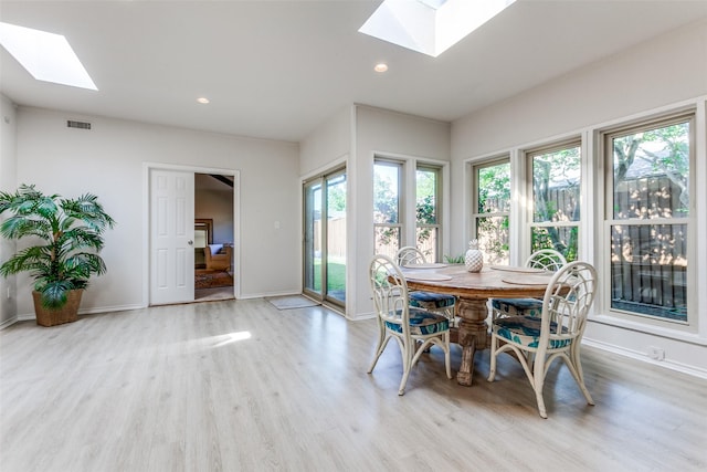 7403 Authon Dr, Dallas, TX 75248 - dining room with a skylight, plenty of natural light, light wood finished floors, and recessed lighting
