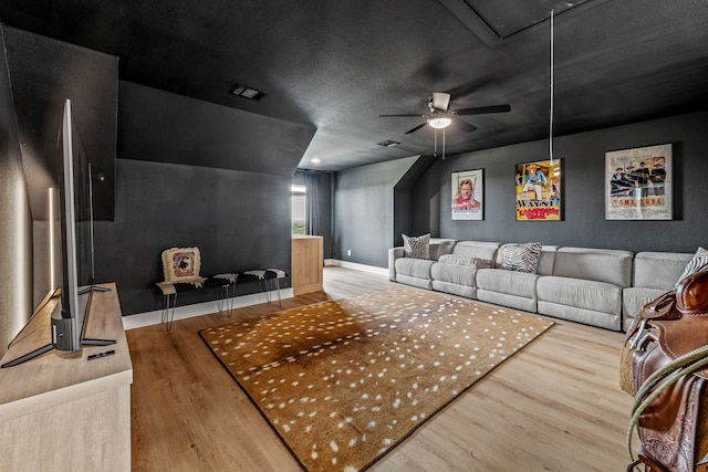 5219 Old Dennis Rd, Weatherford, TX 76087 - home theater featuring wood finished floors, a ceiling fan, and baseboards