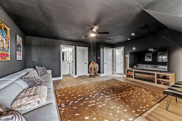 5219 Old Dennis Rd, Weatherford, TX 76087 - living room with wood finished floors and ceiling fan