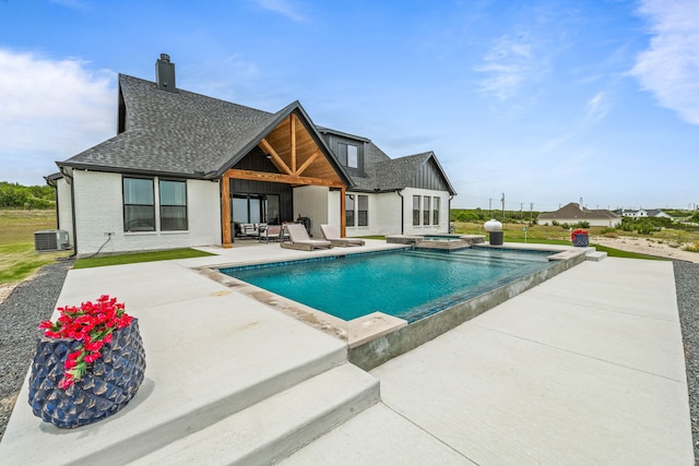 5219 Old Dennis Rd, Weatherford, TX 76087 - view of swimming pool featuring a patio, central air condition unit, and a pool with connected hot tub