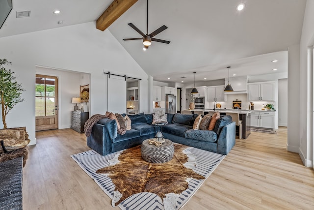 5219 Old Dennis Rd, Weatherford, TX 76087 - living area featuring a barn door, high vaulted ceiling, ceiling fan, recessed lighting, and beamed ceiling