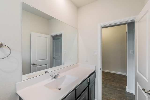 136 Wagon Mound, Waxahachie, TX 75167 - bathroom featuring wood finished floors, vanity, and baseboards