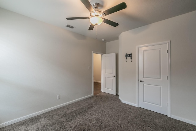 136 Wagon Mound, Waxahachie, TX 75167 - unfurnished bedroom with dark carpet, baseboards, and ceiling fan