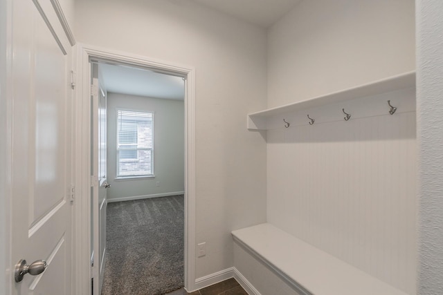 136 Wagon Mound, Waxahachie, TX 75167 - mudroom with dark colored carpet and baseboards