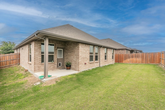 136 Wagon Mound, Waxahachie, TX 75167 - back of house with brick siding and a patio area