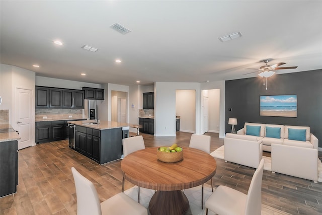 136 Wagon Mound, Waxahachie, TX 75167 - dining space with dark wood-type flooring, recessed lighting, ceiling fan, and baseboards
