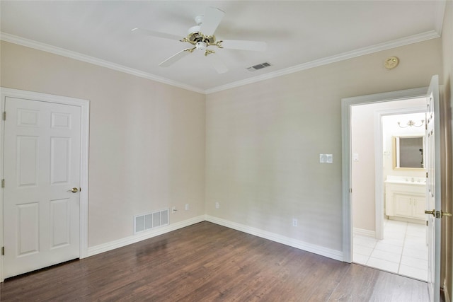 7712 Ravenswood Rd, Granbury, TX 76049 - spare room with wood finished floors, ornamental molding, ceiling fan, baseboards, and a sink