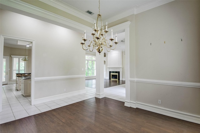 7712 Ravenswood Rd, Granbury, TX 76049 - unfurnished dining area featuring light tile patterned floors, a chandelier, ornamental molding, and baseboards