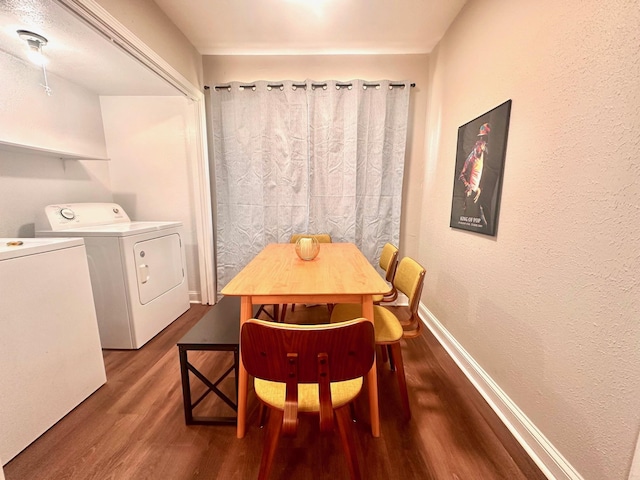 dining space featuring separate washer and dryer, wood finished floors, a textured wall, and baseboards