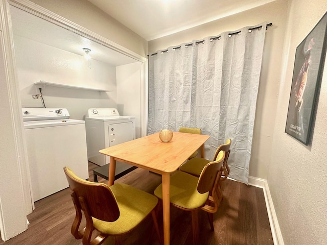 dining space with washing machine and clothes dryer and wood finished floors