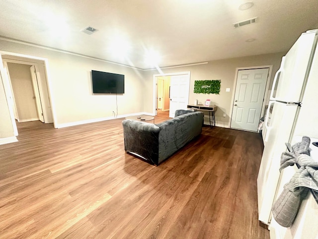 living room featuring light wood-style floors and baseboards