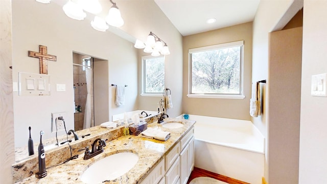2807 Wind Point Ct, Tolar, TX 76476 - full bathroom featuring a garden tub, double vanity, tiled shower, and a chandelier