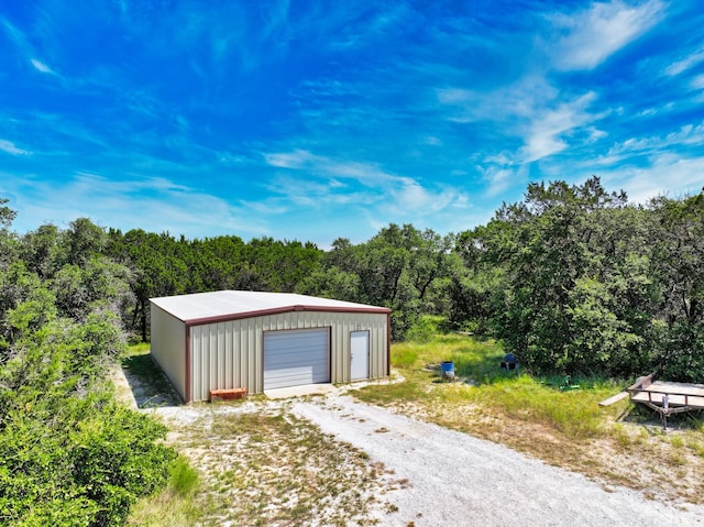 2807 Wind Point Ct, Tolar, TX 76476 - detached garage featuring a forest view