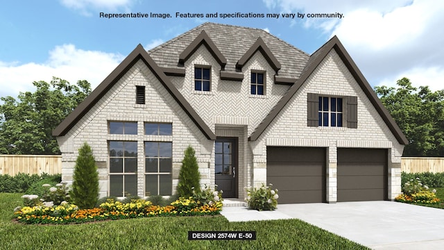 713 Arden Ln, Celina, TX 75009 - view of front facade with fence, an attached garage, concrete driveway, stone siding, and brick siding